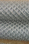 Close-up of galvanized chain link fencing roll

Installed Class 1 chain link fence for residential use

11 gauge steel wire mesh fencing detail

Chain link fence with metal posts on concrete

Heavy-duty galvanized fence roll packaging