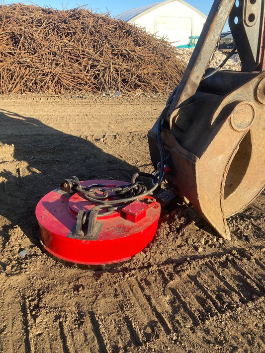 Red 50-inch excavator scrap lifting magnet with 230V connection
Heavy-duty metal separator magnet for demolition and recycling
Magnetic attachment for excavators handling ferrous scrap