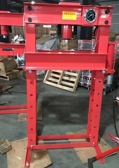 Close-up of dual hydraulic pump controls on 50 ton press