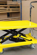 Yellow 500 lb hydraulic lift cart with platform
Side view of mobile work table with foot pedal
Hydraulic lift cart with locking swivel casters
Adjustable scissor lift cart for warehouse
Heavy-duty shop cart with hand lever control