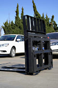 Side view of 5000 lb side shift pallet forks for skid steer

Heavy-duty hydraulic pallet fork with side shift mechanism

Pallet fork attachment mounted on forklift outdoors

Black steel frame skid steer pallet forks with side shift

Industrial pallet forks for warehouse and yard use