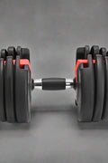 52.5 lb adjustable dumbbell with metal handle and rubber-coated plates
Side view of single adjustable dumbbell for compact home gym use
Unboxed adjustable dumbbell set with weight plate configuration
Compact strength training dumbbell with ergonomic grip