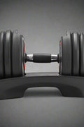 52.5 lb adjustable dumbbell with metal handle and rubber-coated plates
Side view of single adjustable dumbbell for compact home gym use
Unboxed adjustable dumbbell set with weight plate configuration
Compact strength training dumbbell with ergonomic grip