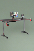 "55-inch carbon fiber gaming desk with LED lighting, USB charging station, dual monitor mount, and headphone hook – ideal for gaming or remote work setups"