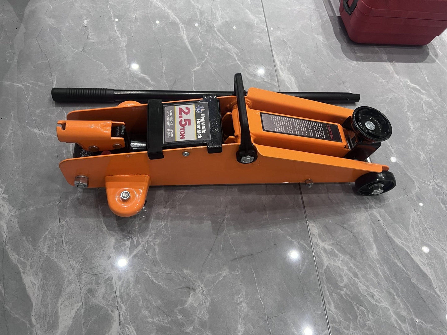 2.5 Ton Hydraulic Floor Jack – Top View in Orange Steel Frame
Heavy-Duty Car Jack – Front Angle with Wheels and Handle
Compact Steel Floor Jack – Side Profile for Low Clearance Vehicles