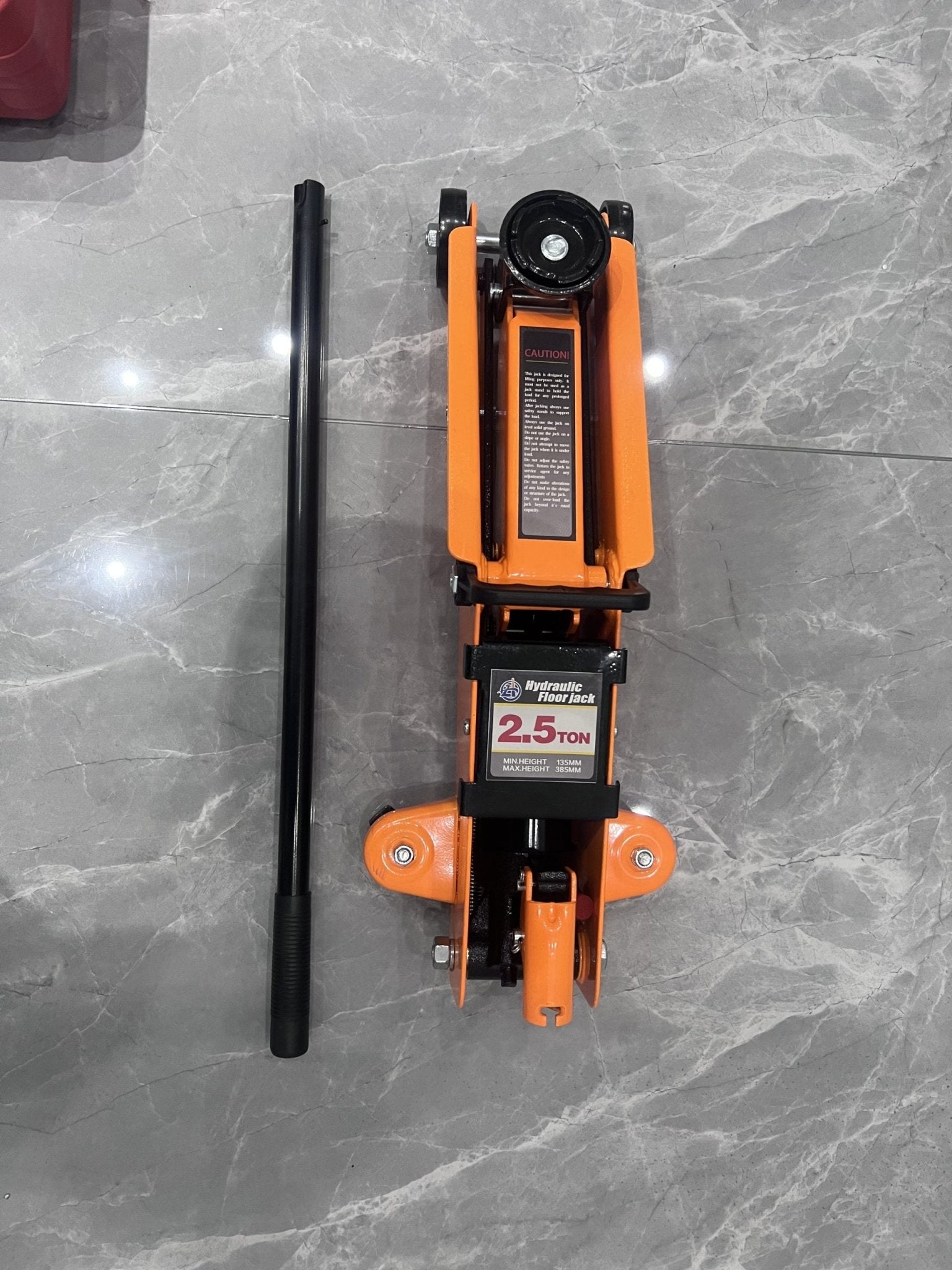 2.5 Ton Hydraulic Floor Jack – Top View in Orange Steel Frame
Heavy-Duty Car Jack – Front Angle with Wheels and Handle
Compact Steel Floor Jack – Side Profile for Low Clearance Vehicles