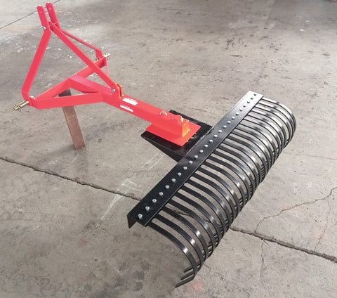 Red 5 FT landscape rake for tractor with 3-point hitch

Side view of landscape rake attachment on concrete

Close-up of tine design and mounting frame

3-point hitch mount landscape rake back view