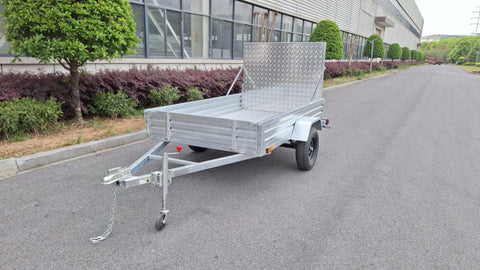 "5x8 galvanized utility trailer with built-in ATV ramps"

"Rust-resistant utility trailer parked near grass lot"

"Heavy-duty galvanized trailer with side view of ramps"