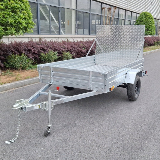 "5x8 galvanized utility trailer with built-in ATV ramps"

"Rust-resistant utility trailer parked near grass lot"

"Heavy-duty galvanized trailer with side view of ramps"