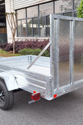 "5x8 galvanized utility trailer with built-in ATV ramps"

"Rust-resistant utility trailer parked near grass lot"

"Heavy-duty galvanized trailer with side view of ramps"