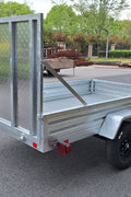 "5x8 galvanized utility trailer with built-in ATV ramps"

"Rust-resistant utility trailer parked near grass lot"

"Heavy-duty galvanized trailer with side view of ramps"