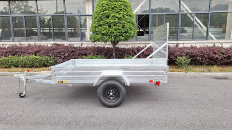 "5x8 galvanized utility trailer with built-in ATV ramps"

"Rust-resistant utility trailer parked near grass lot"

"Heavy-duty galvanized trailer with side view of ramps"