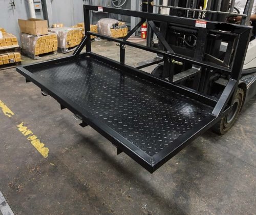 6 FT carry all platform for tractors – 3-point hitch rear attachment
Rear view of black steel tractor carry platform with diamond plate deck
Close-up of pallet fork-compatible blade pockets on tractor platform