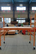 6 FT steel scaffolding unit front view

Adjustable yellow steel scaffold with caster wheels

Platform scaffold in warehouse environment