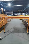 6 FT steel scaffolding unit front view

Adjustable yellow steel scaffold with caster wheels

Platform scaffold in warehouse environment
