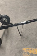Manual hitch dolly TD600 with trailer hookup on pavement

Close-up of TD600 trailer dolly wheels and hitch ball

Side view of trailer dolly being manually pushed

Hand-push trailer dolly on gravel driveway
