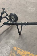 Manual hitch dolly TD600 with trailer hookup on pavement

Close-up of TD600 trailer dolly wheels and hitch ball

Side view of trailer dolly being manually pushed

Hand-push trailer dolly on gravel driveway
