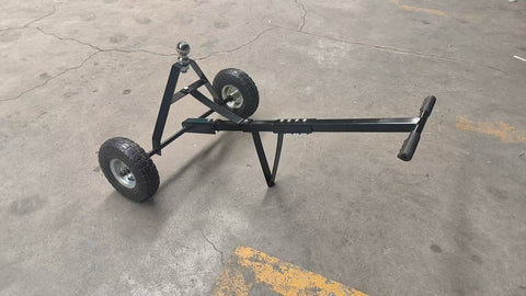 Manual hitch dolly TD600 with trailer hookup on pavement

Close-up of TD600 trailer dolly wheels and hitch ball

Side view of trailer dolly being manually pushed

Hand-push trailer dolly on gravel driveway