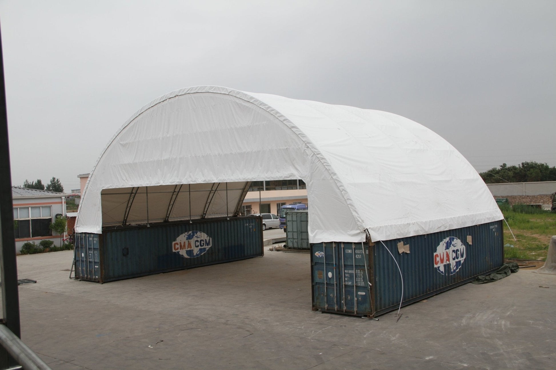 60x80 FT heavy-duty double truss container shelter with 30 oz PVC fabric cover – industrial storage structure
