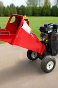 6.5 HP Wood Chipper with Briggs & Stratton engine – side view
Red GS100 wood chipper – front chute and wheels
Compact gasoline-powered wood chipper in garage setup
Rear view of GS100 chipper with large discharge chute