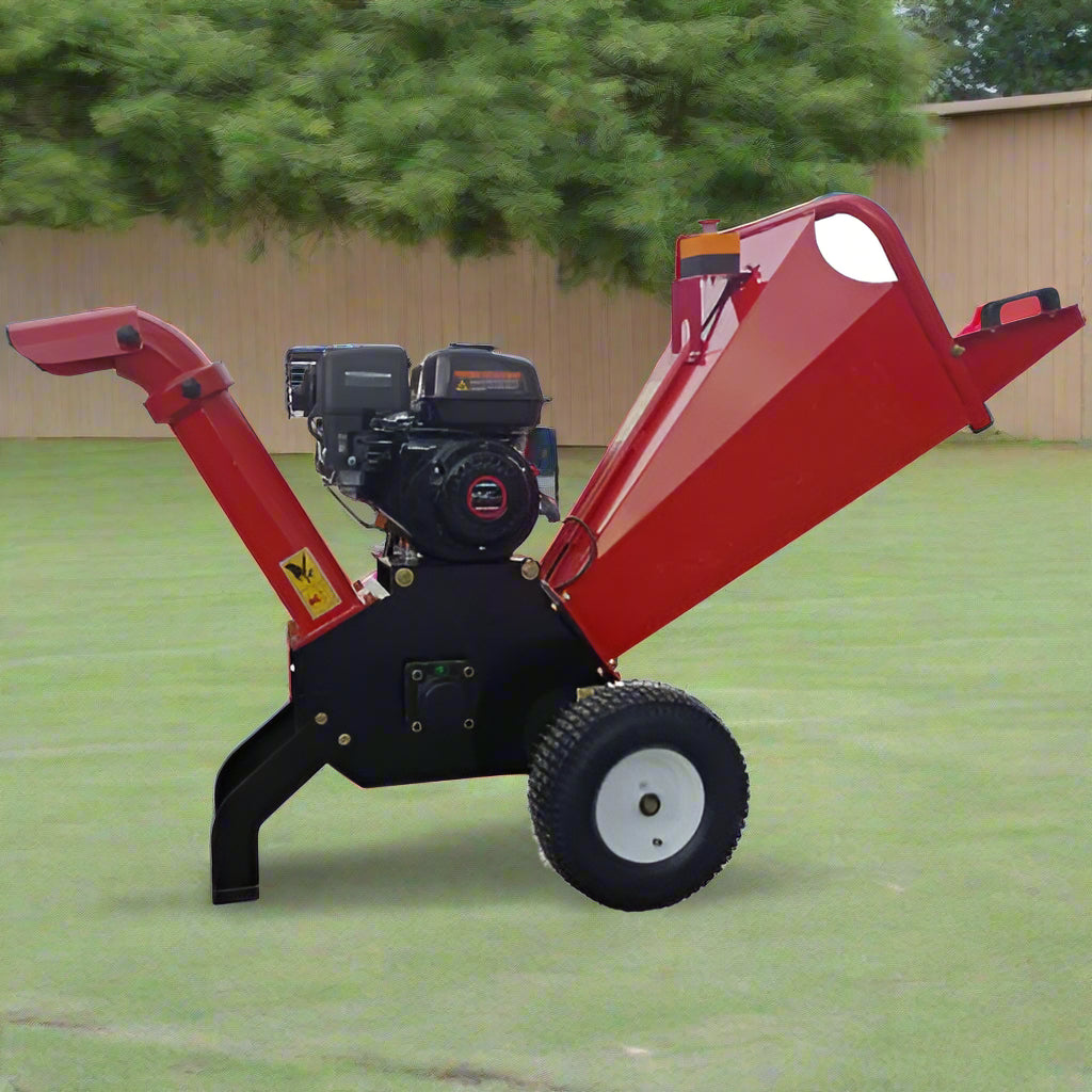 6.5 HP Wood Chipper with Briggs & Stratton engine – side view
Red GS100 wood chipper – front chute and wheels
Compact gasoline-powered wood chipper in garage setup
Rear view of GS100 chipper with large discharge chute