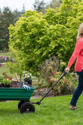 650 lb garden dump wagon with tilt bed and 10 inch tires
Plastic poly bed utility cart for lawn and yard use
Green heavy-duty garden wagon with steel frame
Garden cart with pneumatic tires and dump feature