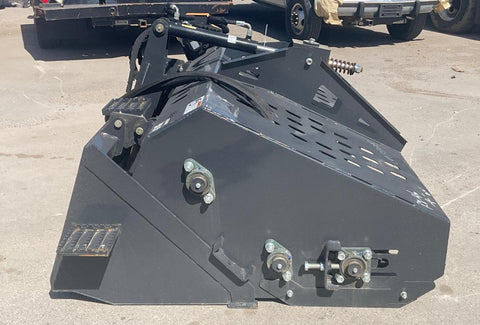 "68 inch skid steer landscape rake bucket with hydraulic top cover"
"Heavy-duty grading tool for skid steer loaders"
"Landscape rake with travel skids and handheld remote"
"Hydraulic rake attachment in action on construction site"