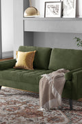 69.7-inch modern velvet sofa in navy blue with tufted back

Gray velvet upholstered sofa with pillows

Side view of modern green couch with wooden legs

Mid-century couch with tufted back and square arms