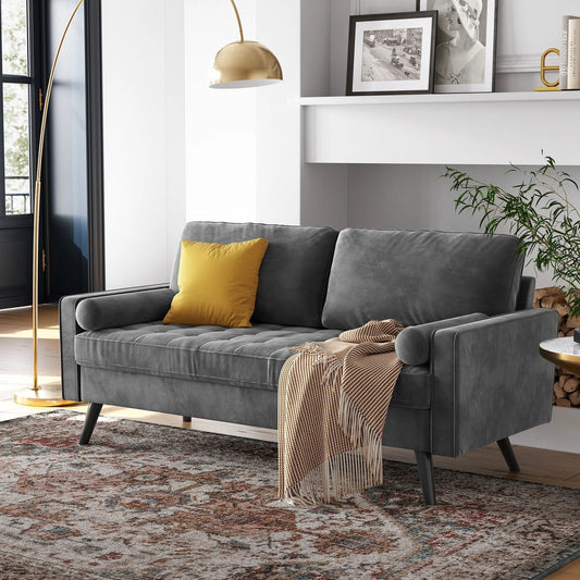 69.7-inch modern velvet sofa in navy blue with tufted back

Gray velvet upholstered sofa with pillows

Side view of modern green couch with wooden legs

Mid-century couch with tufted back and square arms