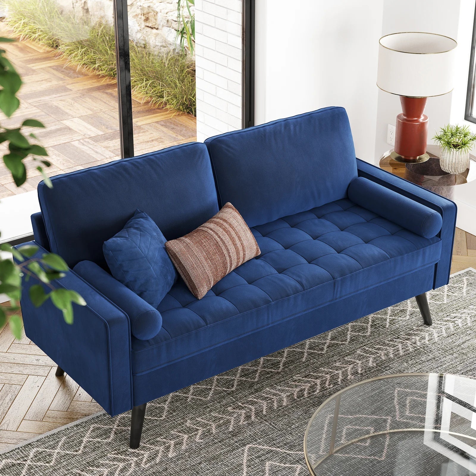 69.7-inch modern velvet sofa in navy blue with tufted back

Gray velvet upholstered sofa with pillows

Side view of modern green couch with wooden legs

Mid-century couch with tufted back and square arms