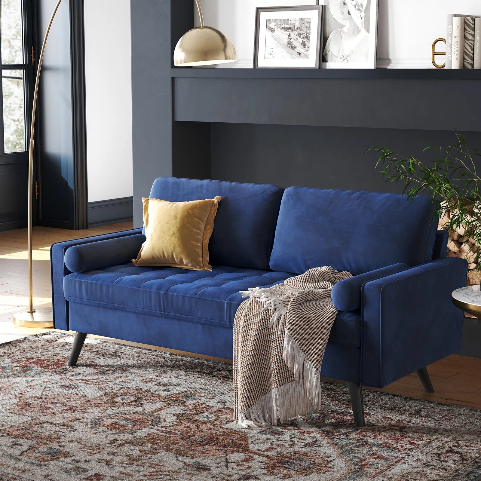 69.7-inch modern velvet sofa in navy blue with tufted back

Gray velvet upholstered sofa with pillows

Side view of modern green couch with wooden legs

Mid-century couch with tufted back and square arms