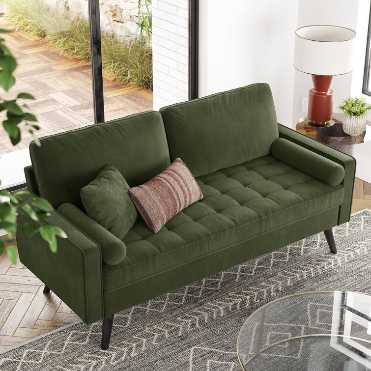 69.7-inch modern velvet sofa in navy blue with tufted back

Gray velvet upholstered sofa with pillows

Side view of modern green couch with wooden legs

Mid-century couch with tufted back and square arms