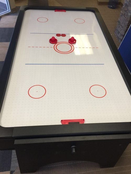 7ft 4-in-1 game table with pool, air hockey, table tennis, and dining top
Convertible multi-game table with storage for accessories
Full-size game table with air hockey surface and blower motor
Modern black and wood game table for family entertainment