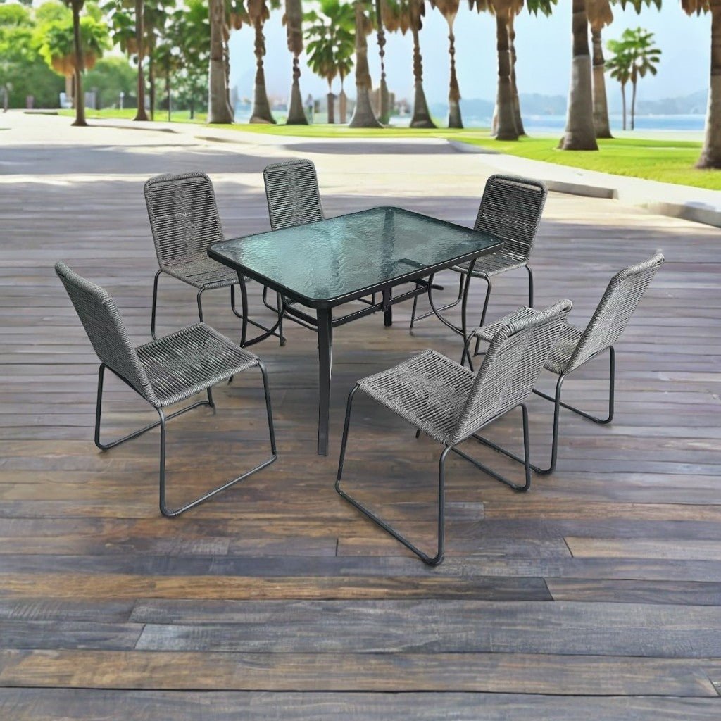 Full 7-piece patio dining set with 6 chairs and steel table

Close-up of stackable outdoor chair with armrest

Outdoor dining table surface with modern weather-resistant finish

Chairs stacked for space-saving storage

Patio dining set placed in backyard setting