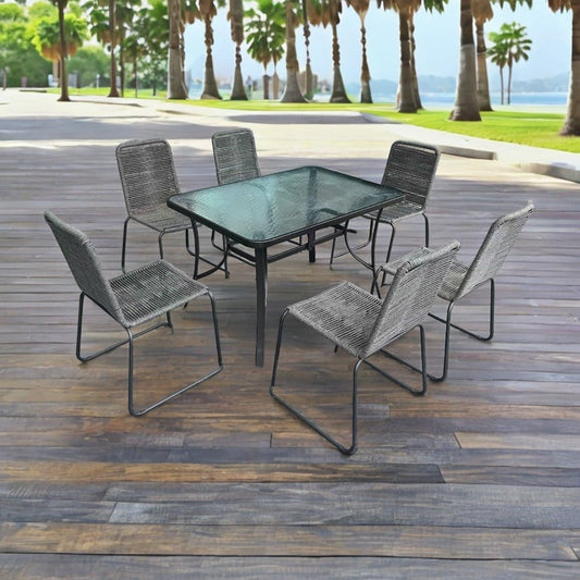 Full 7-piece patio dining set with 6 chairs and steel table

Close-up of stackable outdoor chair with armrest

Outdoor dining table surface with modern weather-resistant finish

Chairs stacked for space-saving storage

Patio dining set placed in backyard setting