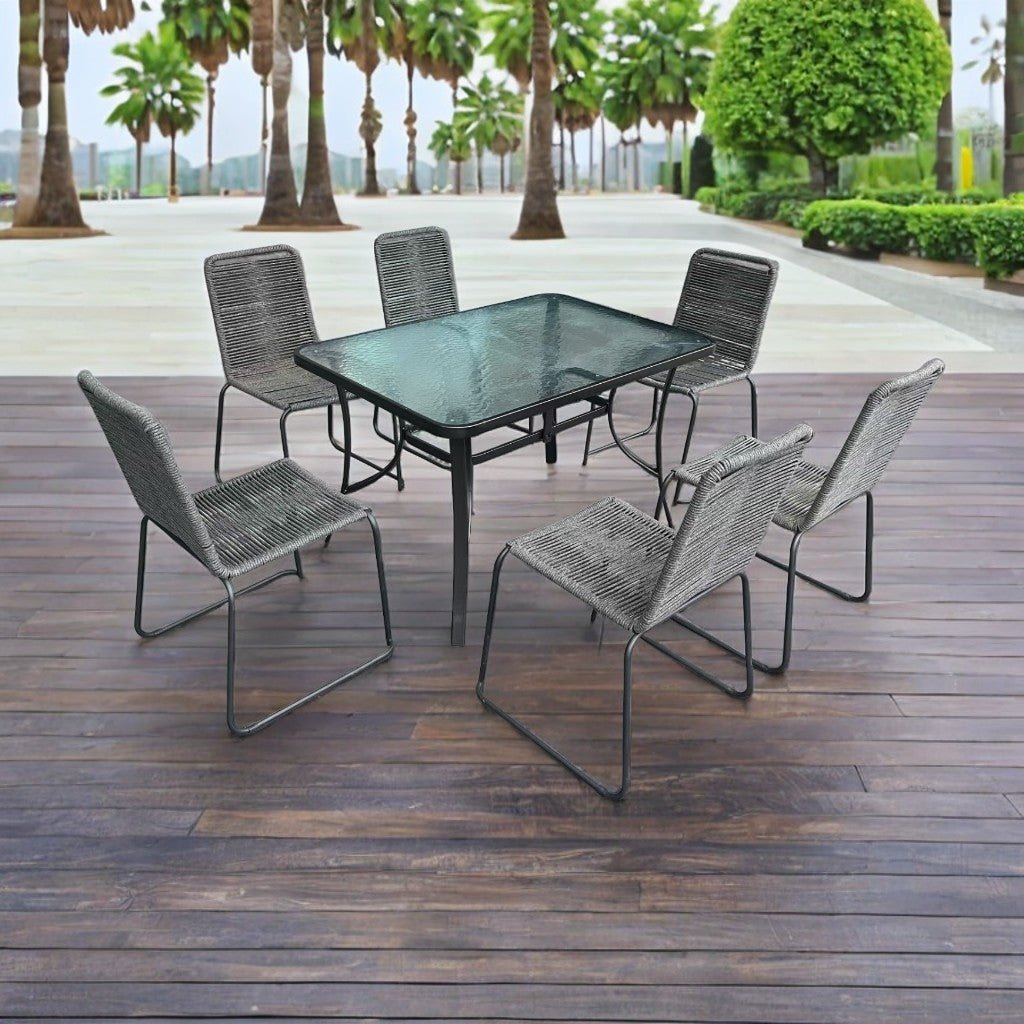 Full 7-piece patio dining set with 6 chairs and steel table

Close-up of stackable outdoor chair with armrest

Outdoor dining table surface with modern weather-resistant finish

Chairs stacked for space-saving storage

Patio dining set placed in backyard setting