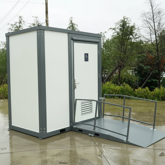 7-foot ADA-compliant portable restroom with ramp in outdoor setting
Inside view of wheelchair-accessible bathroom interior
Front door of handicap bathroom unit with ramp
Washbasin and toilet setup in ADA portable unit
Side view of accessible bathroom setup