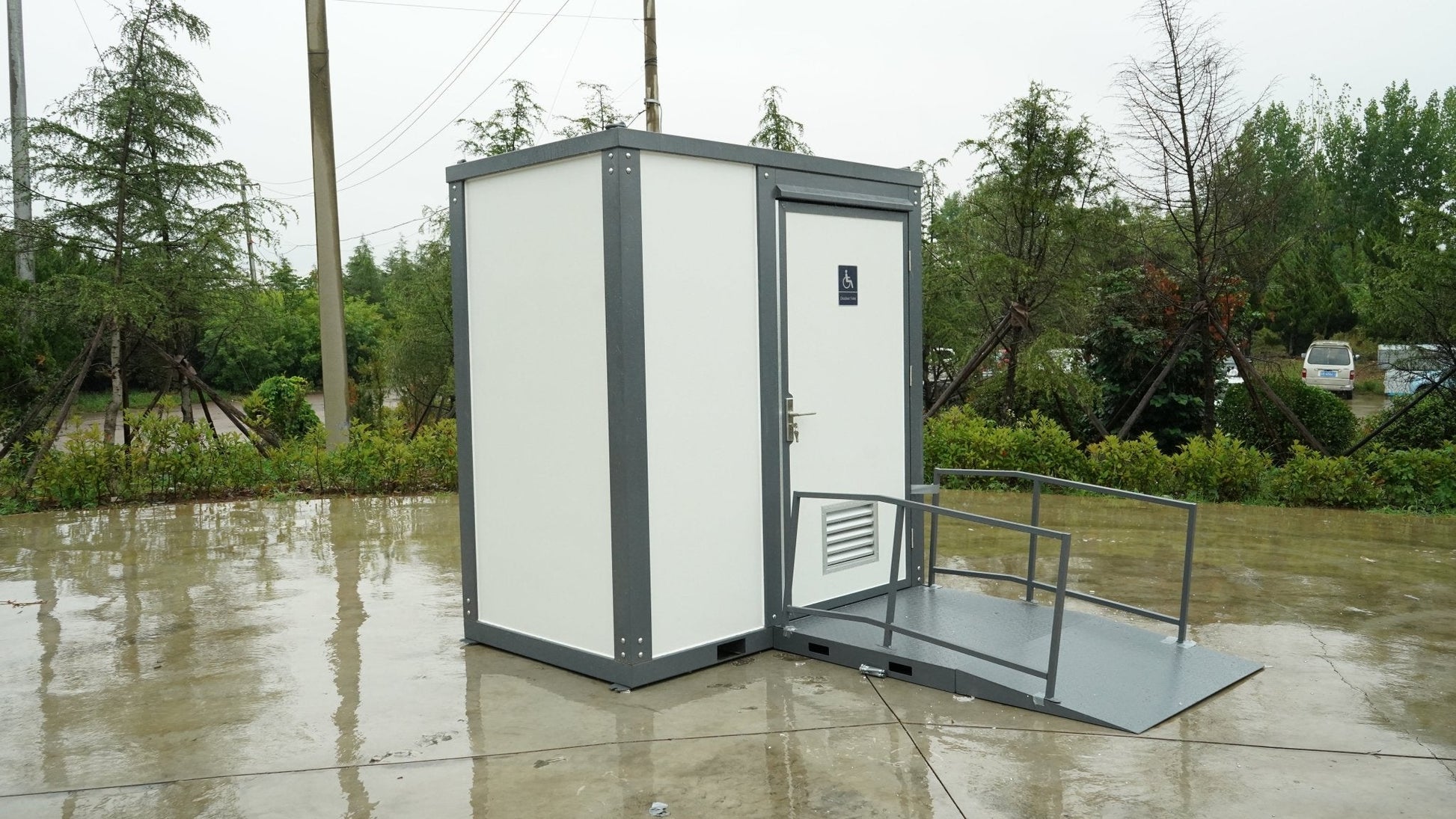 7-foot ADA-compliant portable restroom with ramp in outdoor setting
Inside view of wheelchair-accessible bathroom interior
Front door of handicap bathroom unit with ramp
Washbasin and toilet setup in ADA portable unit
Side view of accessible bathroom setup