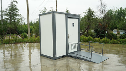 7-foot ADA-compliant portable restroom with ramp in outdoor setting
Inside view of wheelchair-accessible bathroom interior
Front door of handicap bathroom unit with ramp
Washbasin and toilet setup in ADA portable unit
Side view of accessible bathroom setup