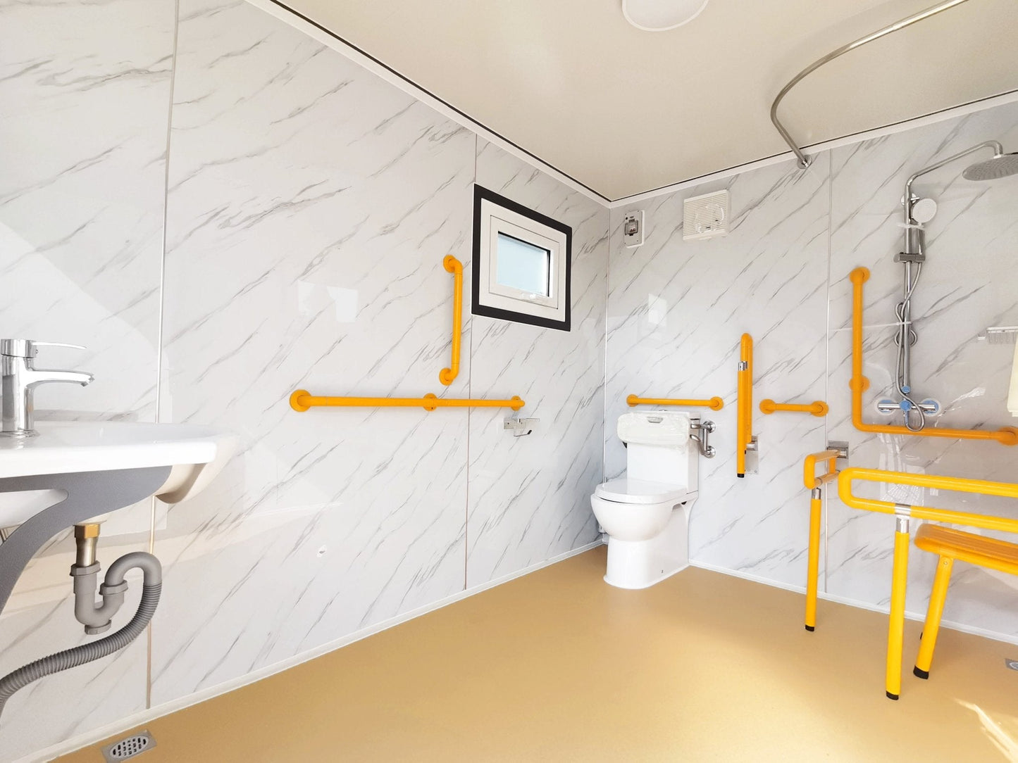 7-foot ADA-compliant portable restroom with ramp in outdoor setting
Inside view of wheelchair-accessible bathroom interior
Front door of handicap bathroom unit with ramp
Washbasin and toilet setup in ADA portable unit
Side view of accessible bathroom setup