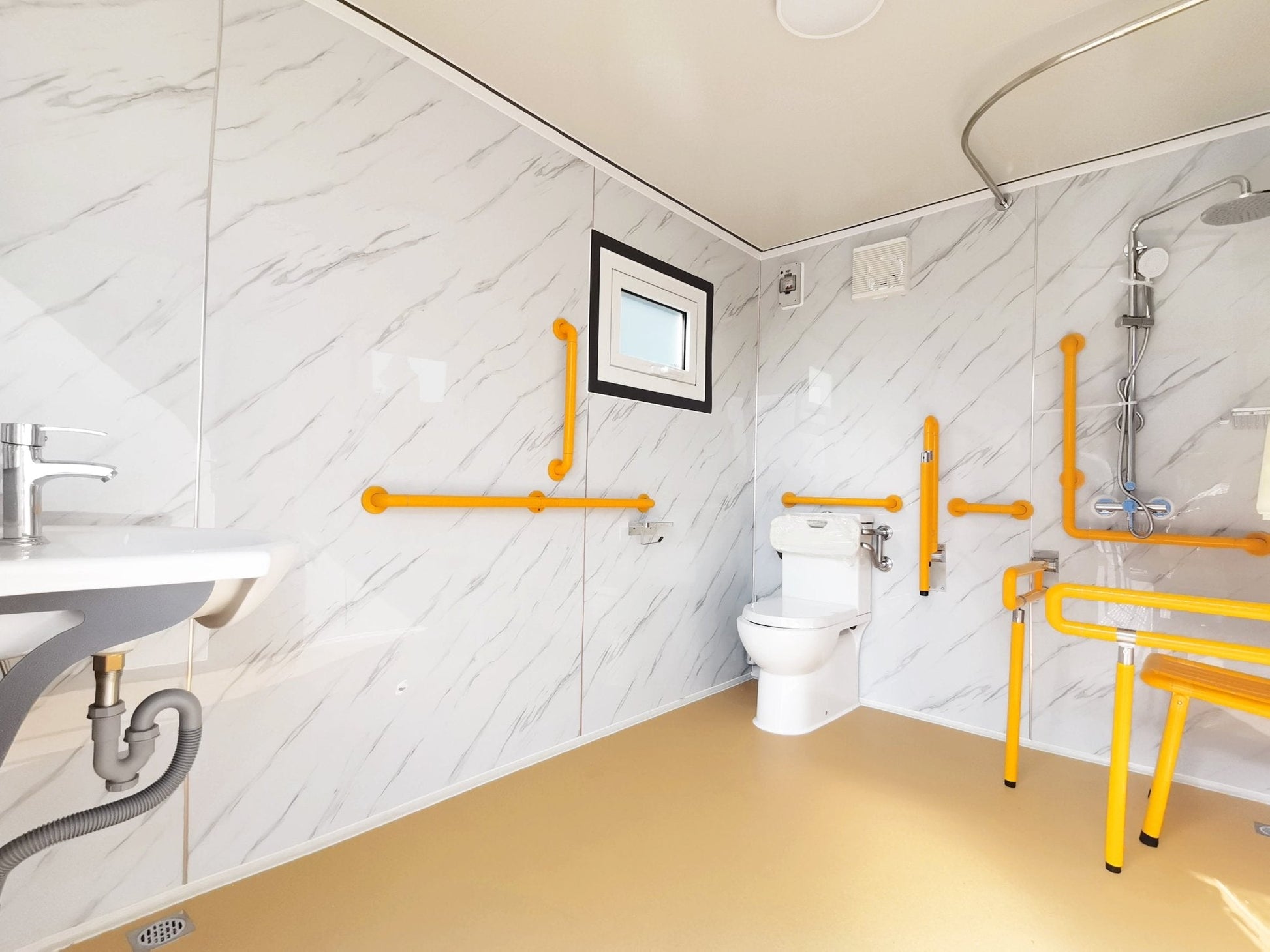 7-foot ADA-compliant portable restroom with ramp in outdoor setting
Inside view of wheelchair-accessible bathroom interior
Front door of handicap bathroom unit with ramp
Washbasin and toilet setup in ADA portable unit
Side view of accessible bathroom setup