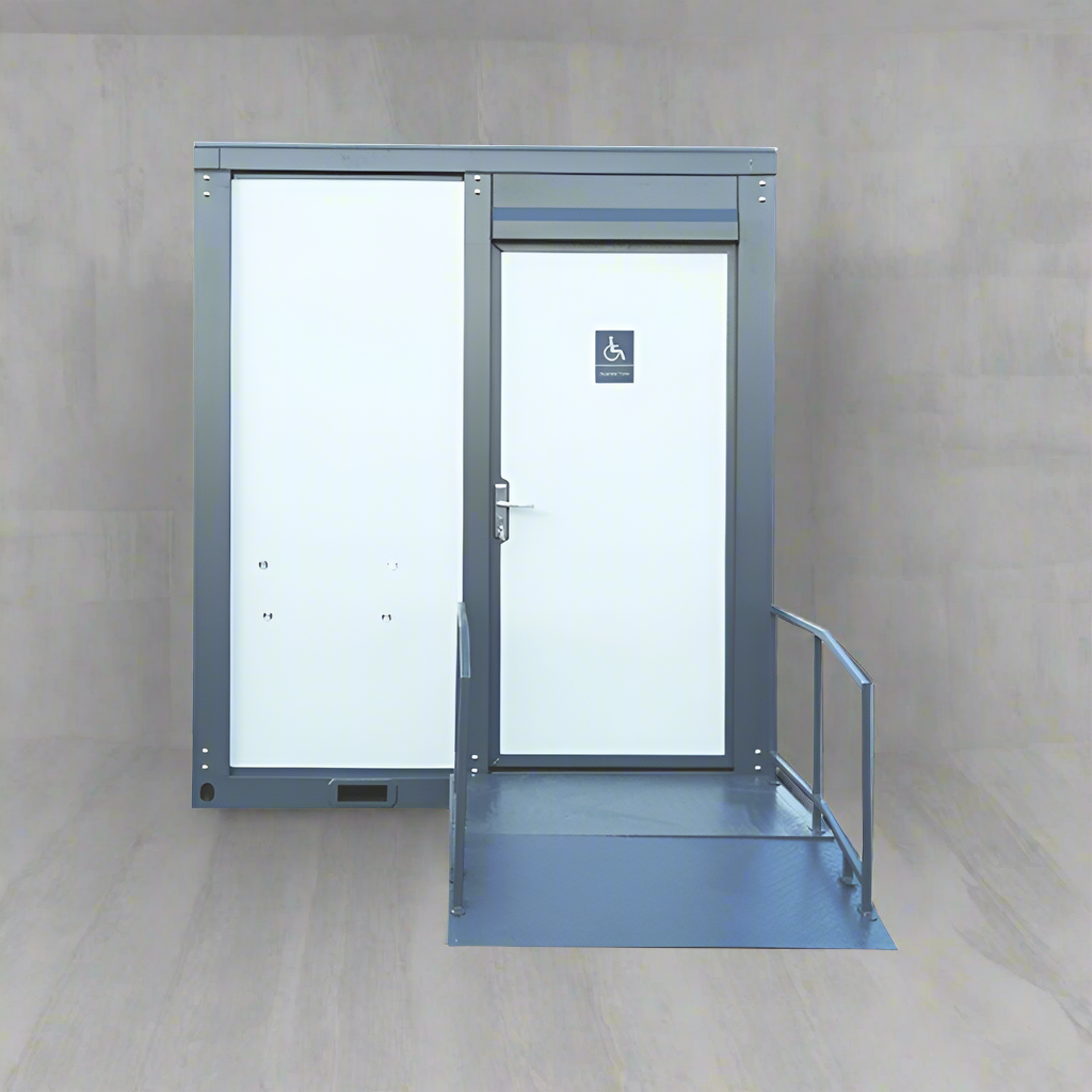 7-foot ADA-compliant portable restroom with ramp in outdoor setting
Inside view of wheelchair-accessible bathroom interior
Front door of handicap bathroom unit with ramp
Washbasin and toilet setup in ADA portable unit
Side view of accessible bathroom setup