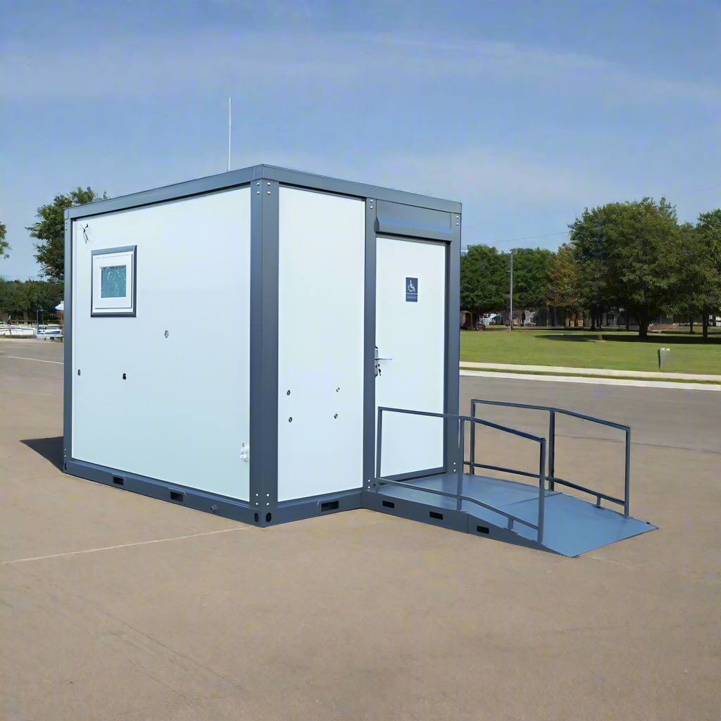 7-foot ADA-compliant portable restroom with ramp in outdoor setting
Inside view of wheelchair-accessible bathroom interior
Front door of handicap bathroom unit with ramp
Washbasin and toilet setup in ADA portable unit
Side view of accessible bathroom setup