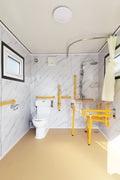 7-foot ADA-compliant portable restroom with ramp in outdoor setting
Inside view of wheelchair-accessible bathroom interior
Front door of handicap bathroom unit with ramp
Washbasin and toilet setup in ADA portable unit
Side view of accessible bathroom setup