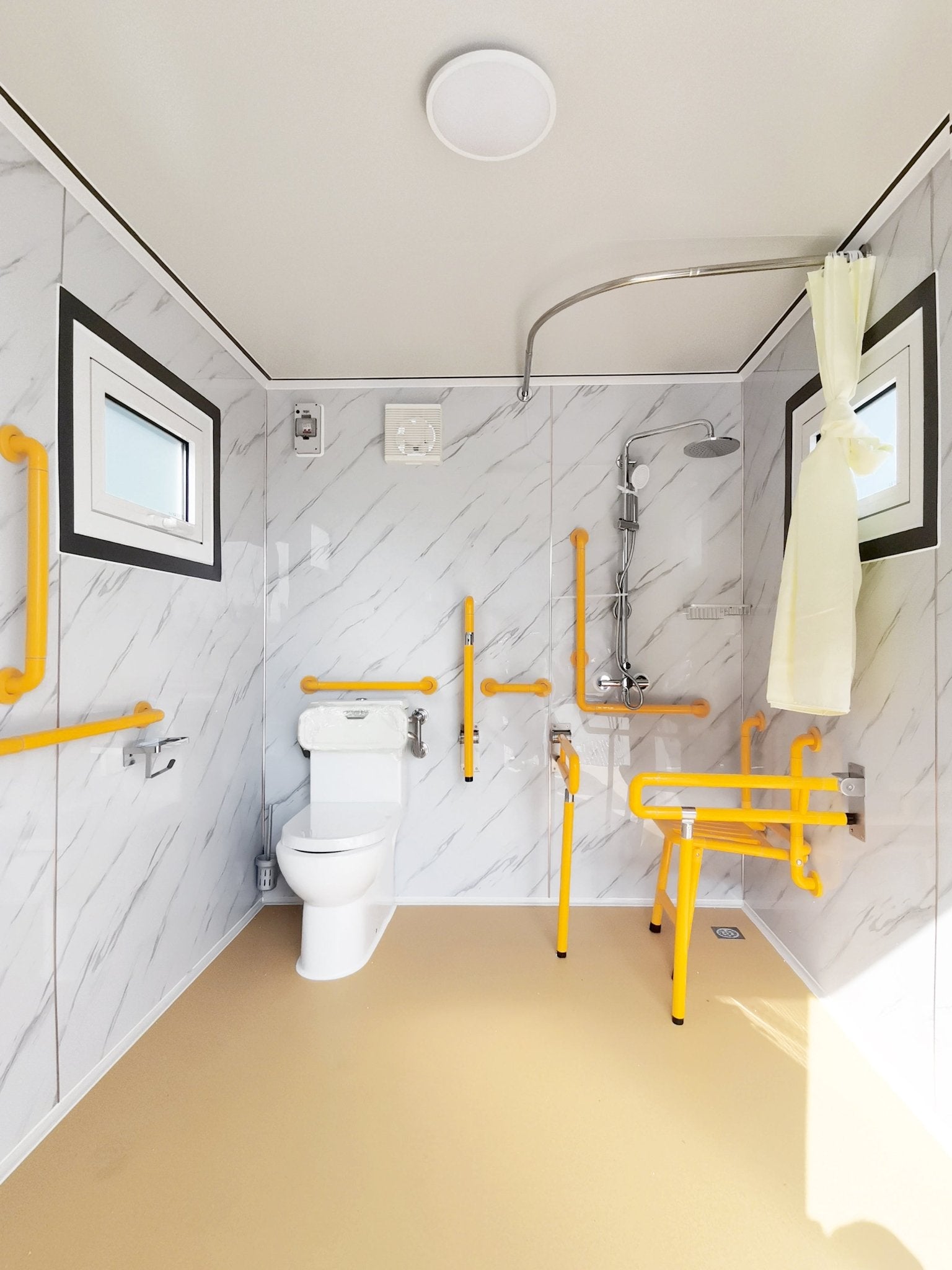7-foot ADA-compliant portable restroom with ramp in outdoor setting
Inside view of wheelchair-accessible bathroom interior
Front door of handicap bathroom unit with ramp
Washbasin and toilet setup in ADA portable unit
Side view of accessible bathroom setup