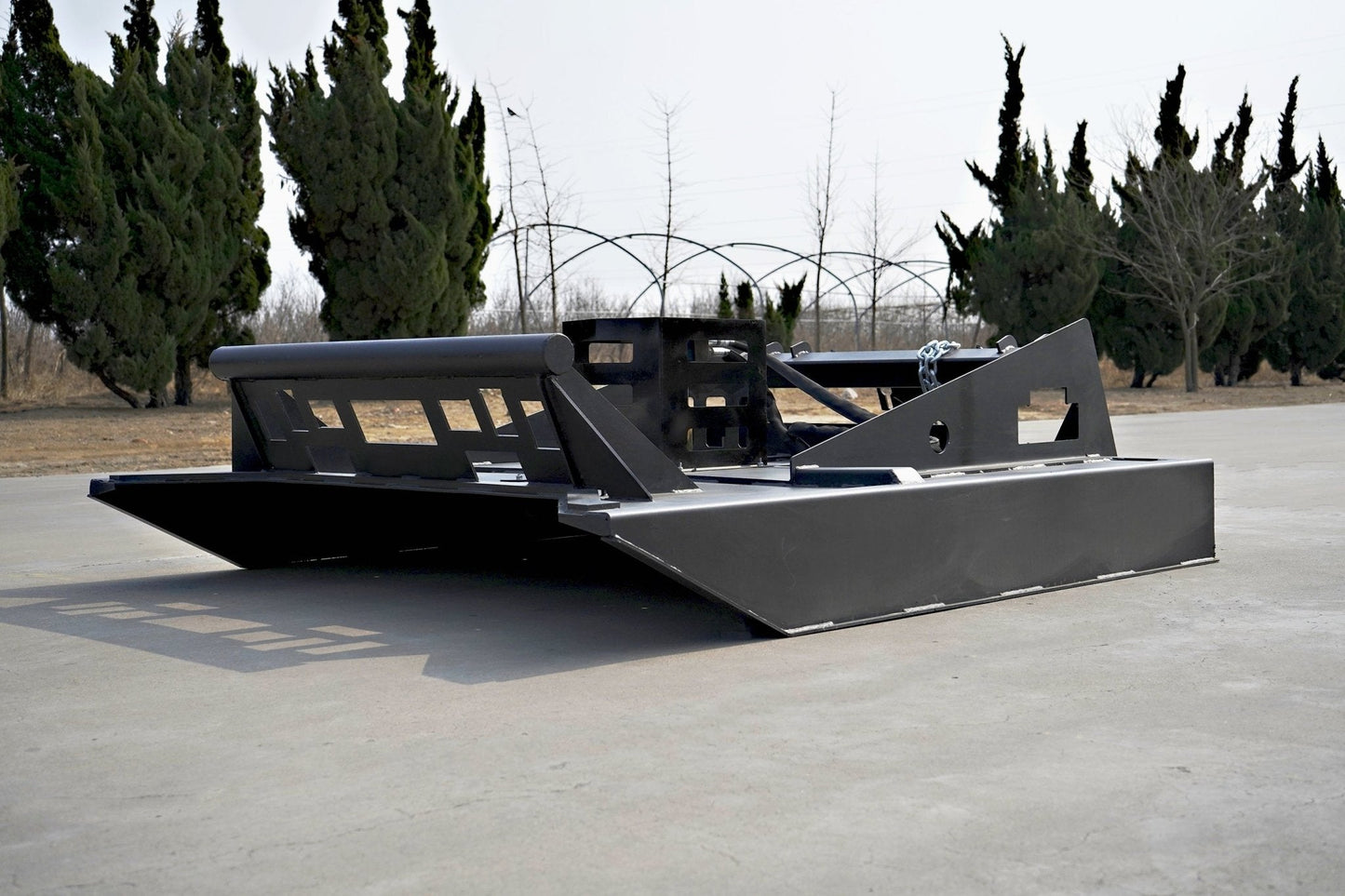 72 inch skid steer brush mower angled view

Underside of heavy-duty cutting blades

66 inch mower installed on skid steer

Skid steer clearing brush and saplings

Blade set and replacement part display