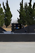 72 inch skid steer brush mower angled view

Underside of heavy-duty cutting blades

66 inch mower installed on skid steer

Skid steer clearing brush and saplings

Blade set and replacement part display