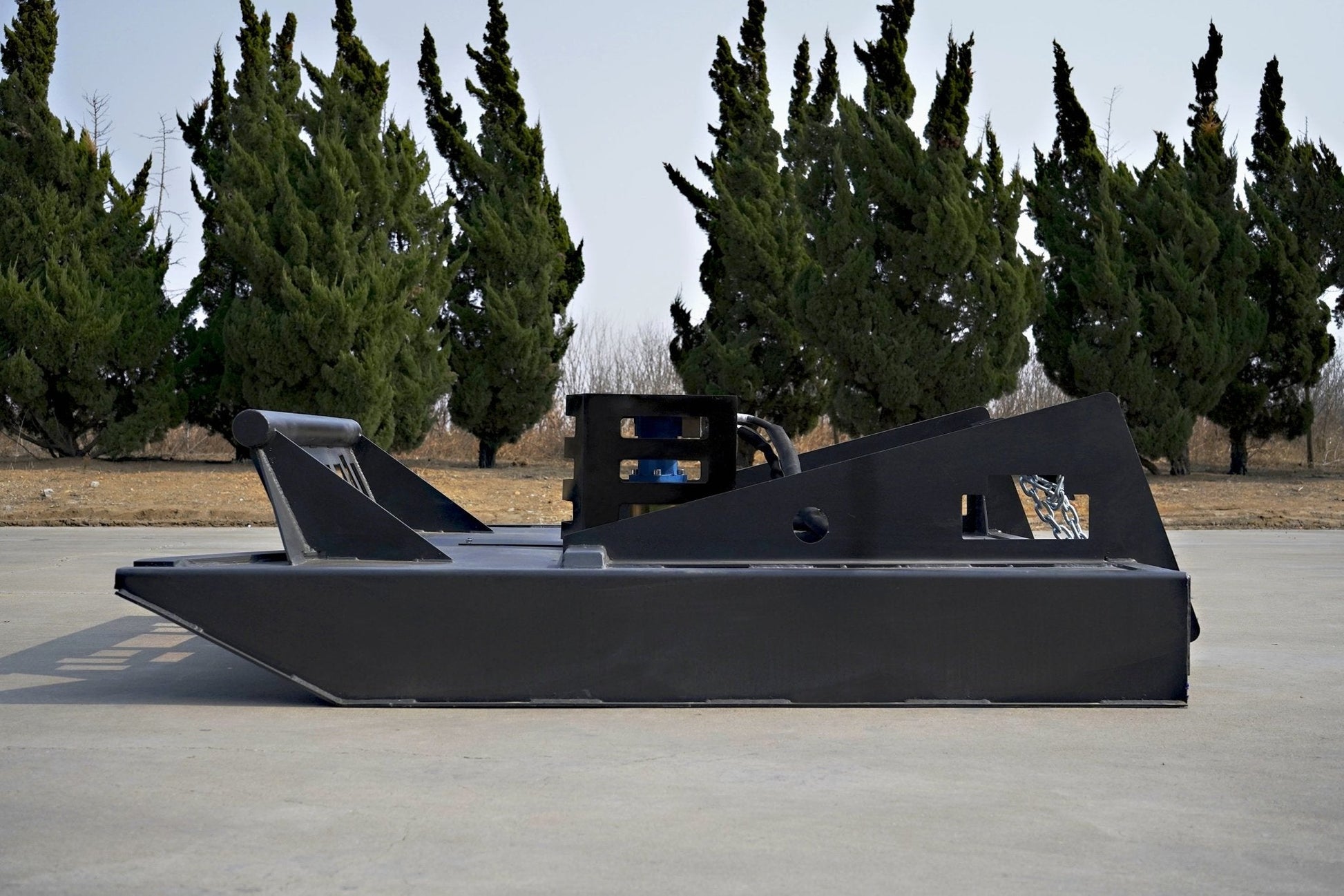 72 inch skid steer brush mower angled view

Underside of heavy-duty cutting blades

66 inch mower installed on skid steer

Skid steer clearing brush and saplings

Blade set and replacement part display