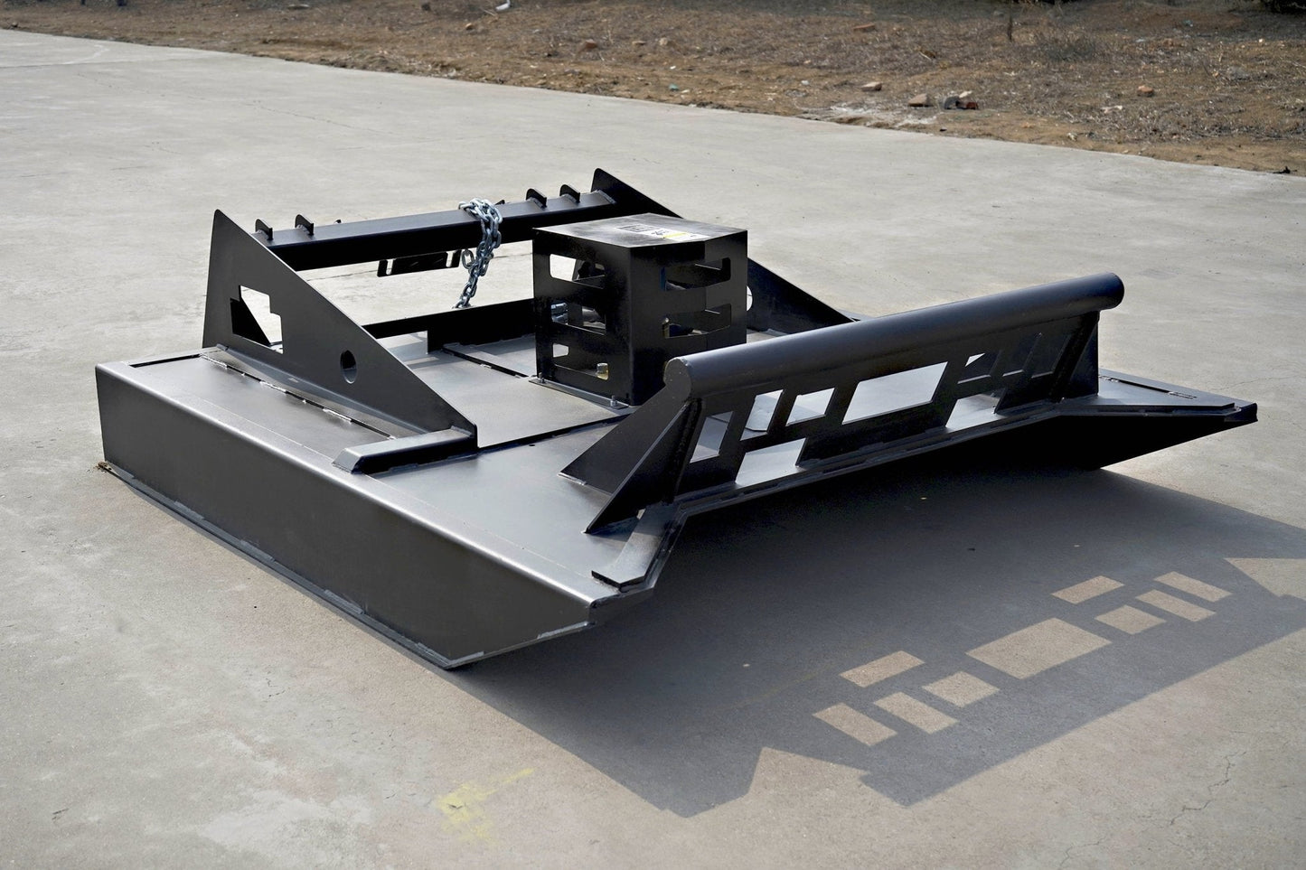 72 inch skid steer brush mower angled view

Underside of heavy-duty cutting blades

66 inch mower installed on skid steer

Skid steer clearing brush and saplings

Blade set and replacement part display