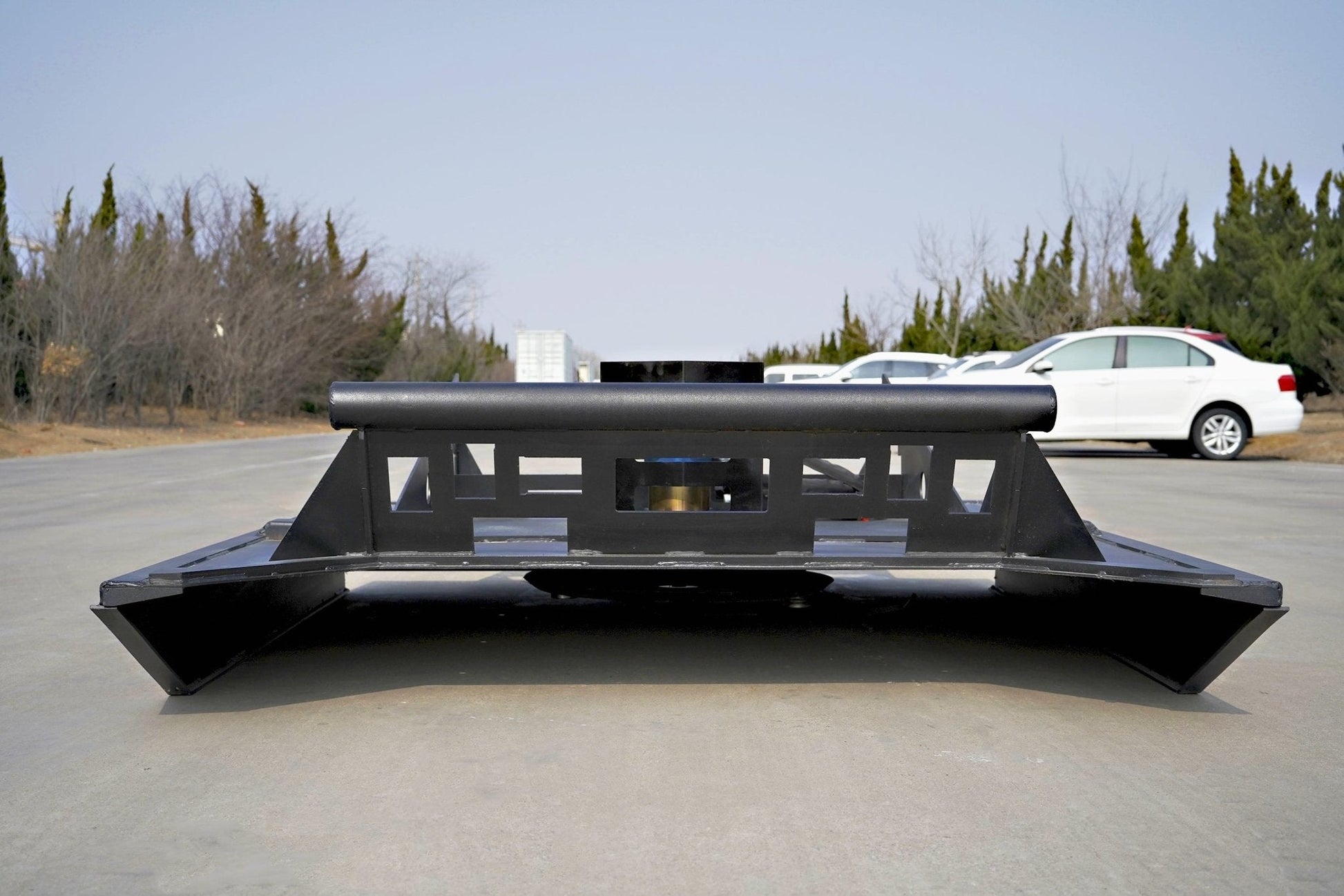 72 inch skid steer brush mower angled view

Underside of heavy-duty cutting blades

66 inch mower installed on skid steer

Skid steer clearing brush and saplings

Blade set and replacement part display